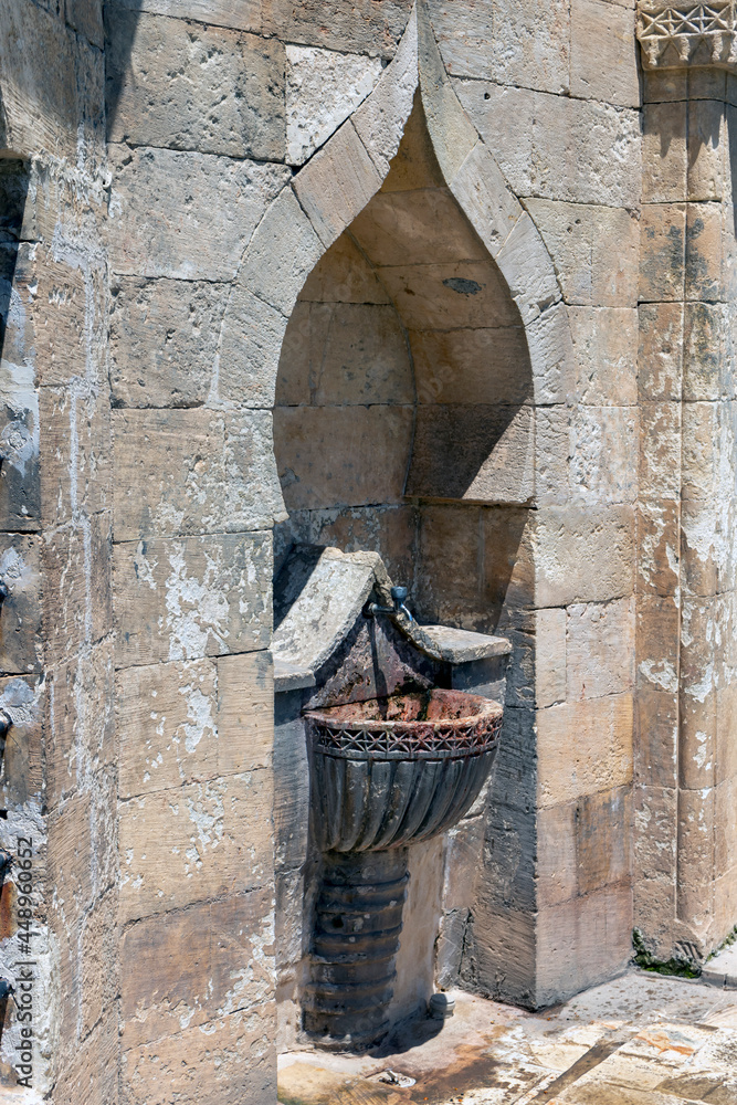 Natural stone fountain. public fountain standing in open space. Natural stone fountain. public fountain standing in open space.