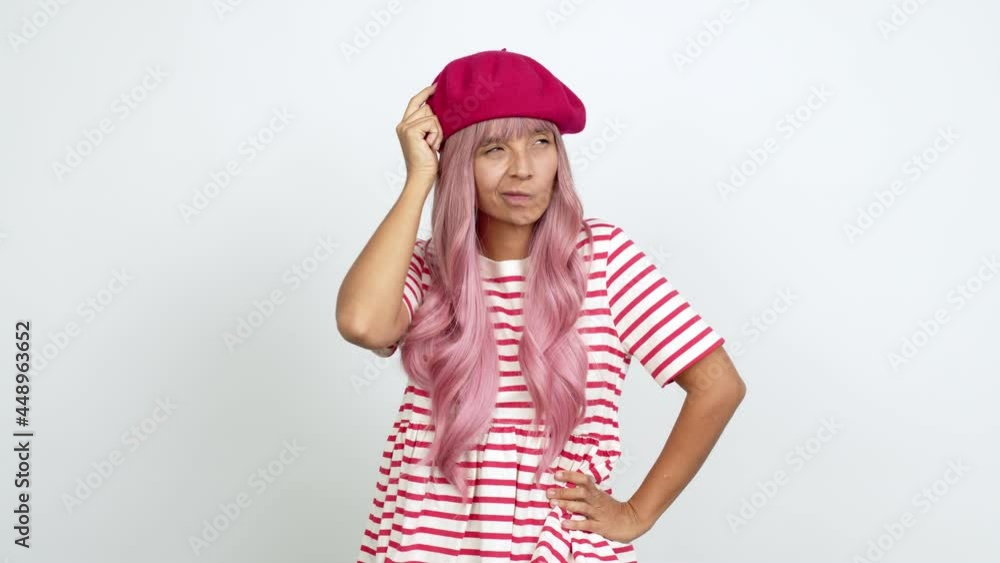 Young woman with pink hair standing and thinking an idea pointing the finger up over isolated background Young woman with pink hair standing and thinking an idea pointing the finger up over isolated background