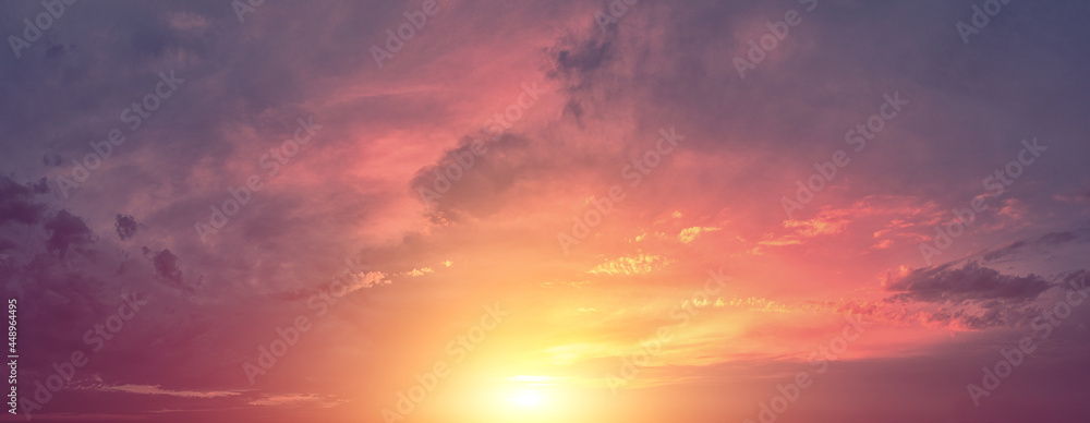 Horizontal panorama of a dramatic red black glowing cloudy sky at sunset. Sky texture. Abstract nature background