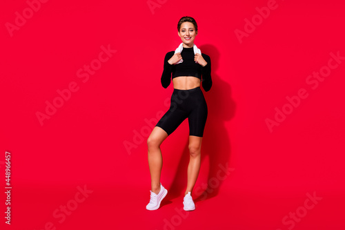 Full length body size view of attractive cheerful slender girl sportive life isolated over bright red color background