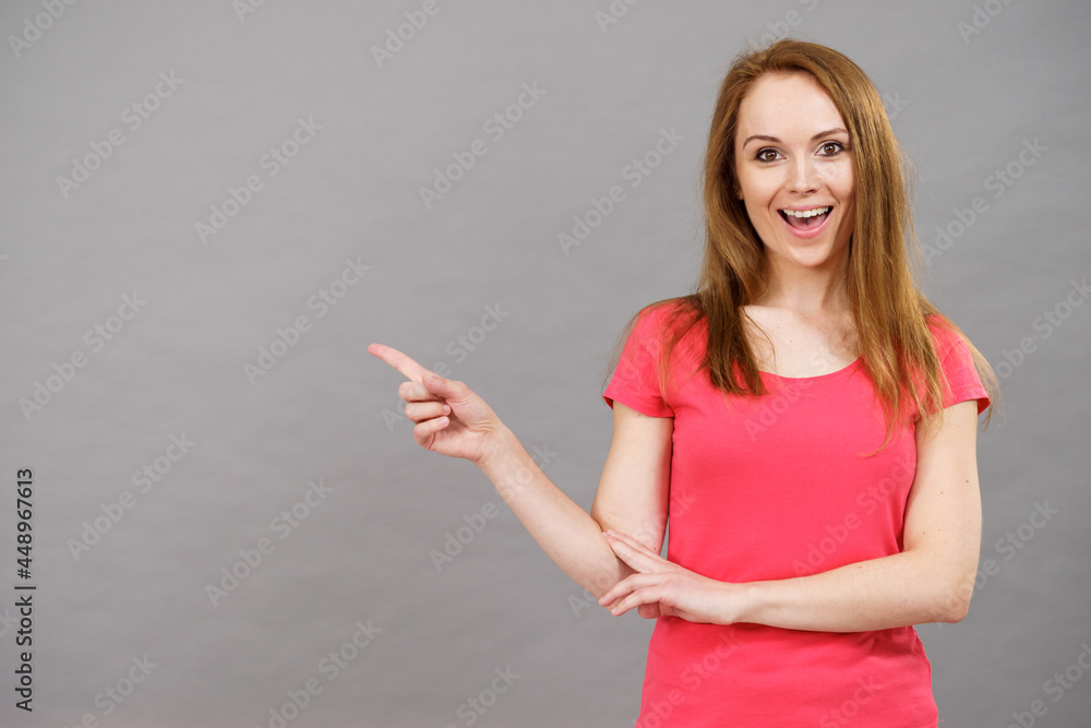 Woman pointing, surprised face expression Woman pointing, surprised face expression