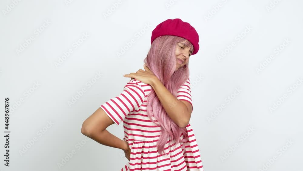 Young woman with pink hair with shoulder pain over isolated background Young woman with pink hair with shoulder pain over isolated background