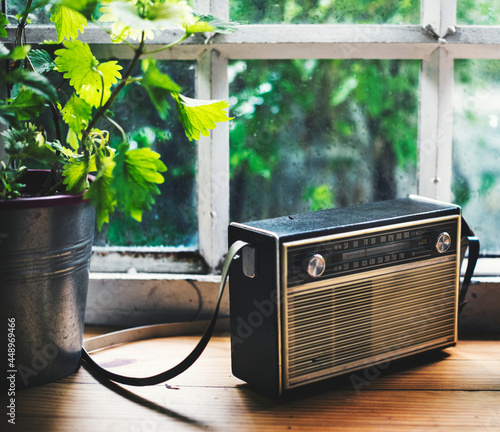 Closeup of vintage radio on wooden table photo