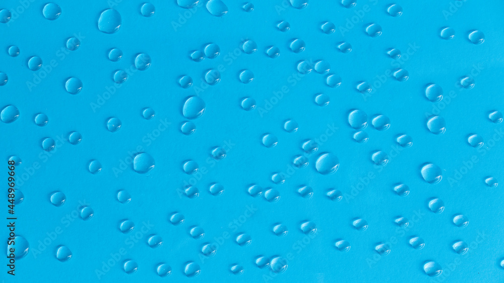 A water drop on a blue background.