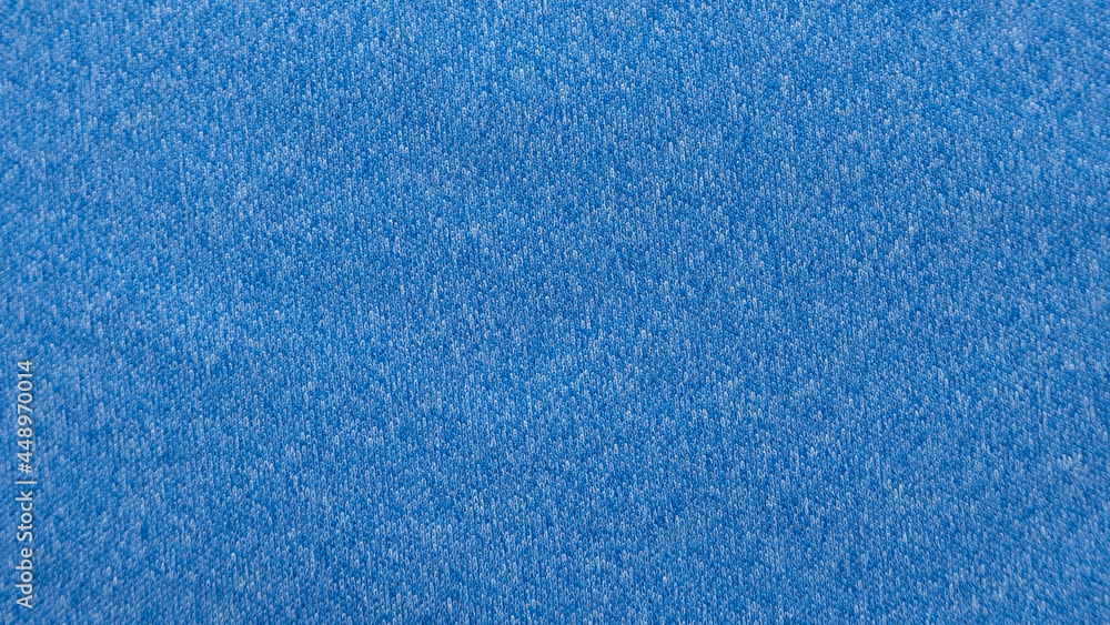 A blue heather knitted fabric textured background made of synthetic fiber.