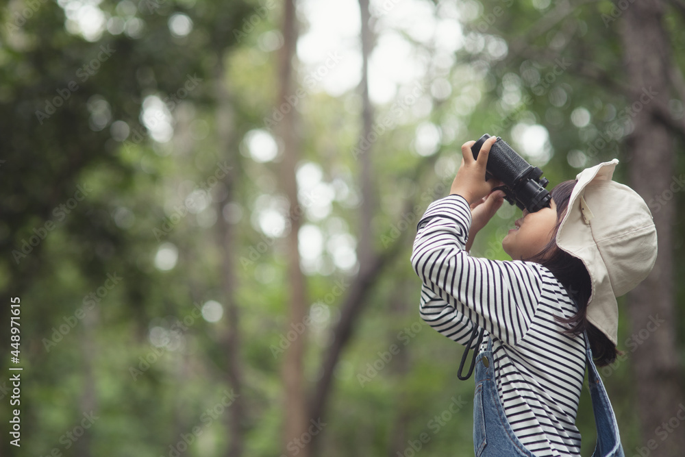 Happy kid looking ahead. Smiling child with the binoculars. Travel and adventure concept. Freedom, vacation Happy kid looking ahead. Smiling child with the binoculars. Travel and adventure concept. Freedom, vacation