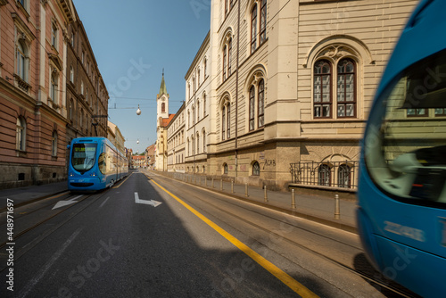 Photographing trams in the middle of the road in the center of city of Zagreb in Croatia