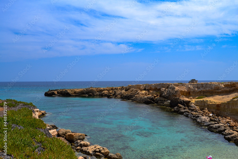 Sea shore. Rocky shore. Rest at the sea. Vacation. Beach. Cyprus.