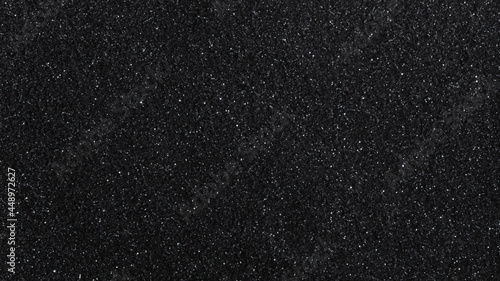 Black glittery textured background
