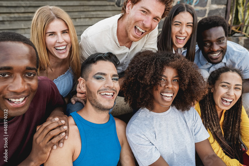 Young diverse people having fun outdoor laughing together - Focus on gay man face