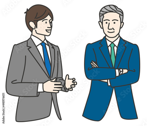 ベテラン社員に相談する若いビジネスマン
