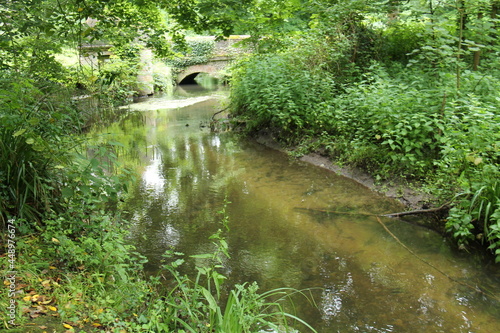 A Flint Stone Bridge Over a Small Woodland River.