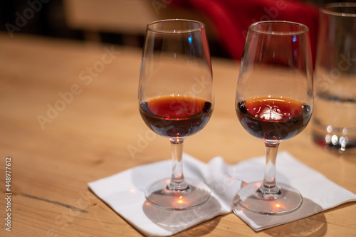 Professional tasting of different fortified dessert ruby, tawny port wines in glasses in porto cellars in Vila Nova de Gaia, Portugal