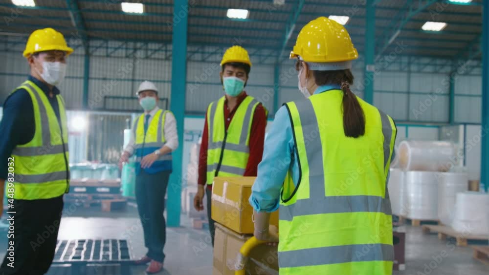 Engineer people are wearing protective mask working in warehouse Engineer people are wearing protective mask working in warehouse