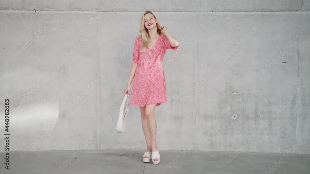 Trendy female near concrete wall Trendy female near concrete wall
