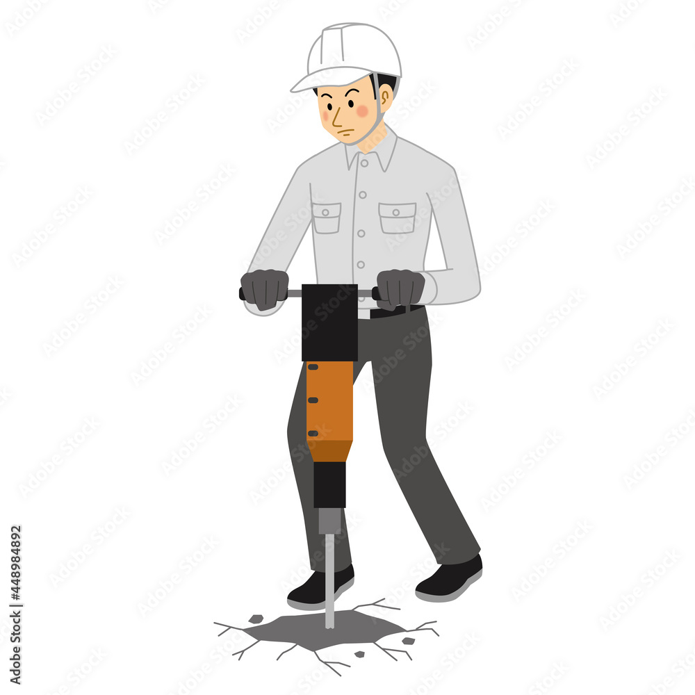 空気圧ハンマーで地面を掘る工事現場の男性