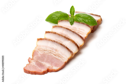 Smoked brisket pork loin decorated green basil leaf, isolated on white background. High resolution image.