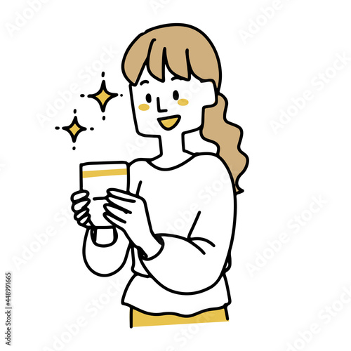貯金通帳を見て嬉しそうにする若い女性