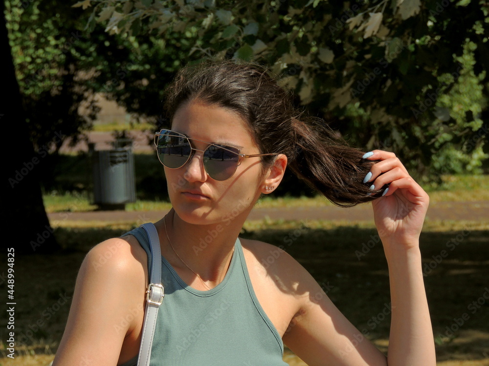 A girl of Caucasian appearance looks at the beauty of the city of St. Petersburg. Urban landscapes, bridges, nature and the rest of the beauty in St. Petersburg. A girl of Caucasian appearance looks at the beauty of the city of St. Petersburg. Urban landscapes, bridges, nature and the rest of the beauty in St. Petersburg.