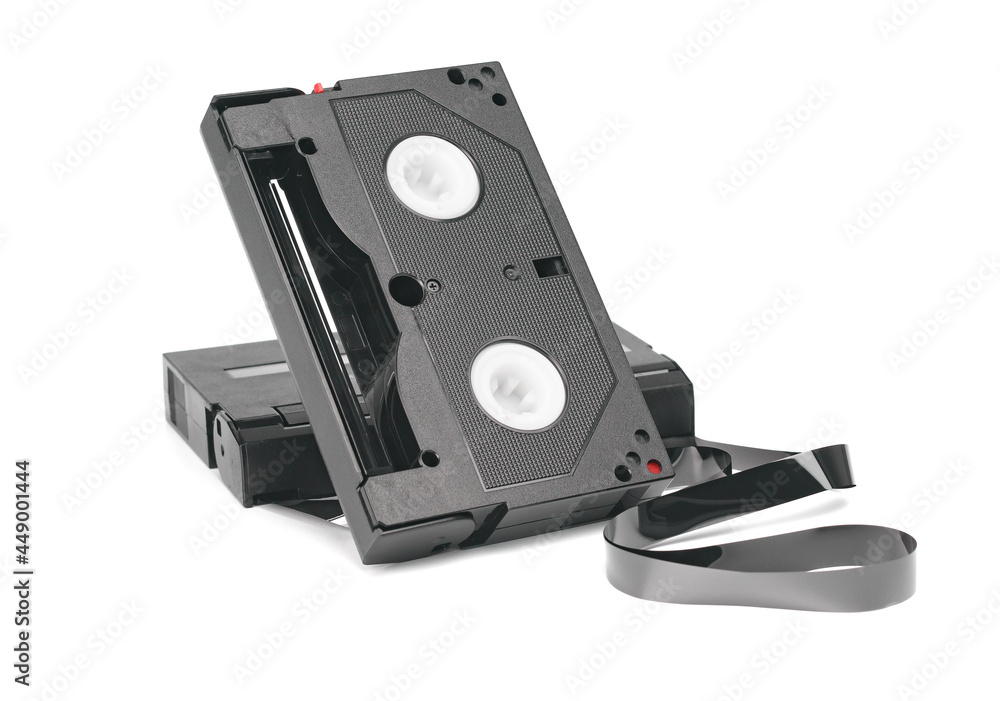 Two mini videotapes with unwound magnetic tape isolated on white. Two mini videotapes with unwound magnetic tape isolated on white.