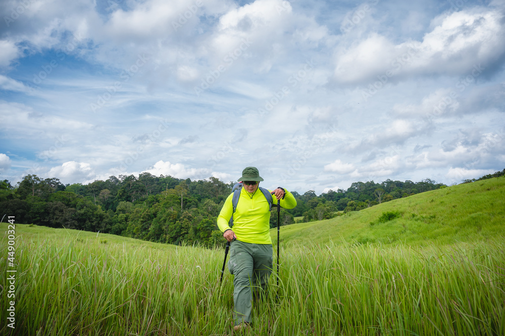 Backpacker trekking to study nature of tropical forest for ecotourism. Tourist trekking to see the beauty of the tropical forest in Khao Yai National Park. UNESCO World Heritage Area, Unseen Thailand. Backpacker trekking to study nature of tropical forest for ecotourism. Tourist trekking to see the beauty of the tropical forest in Khao Yai National Park. UNESCO World Heritage Area, Unseen Thailand.