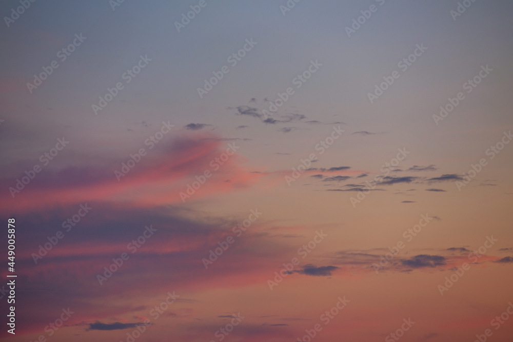 evening sky with clouds and rays of the sun, background