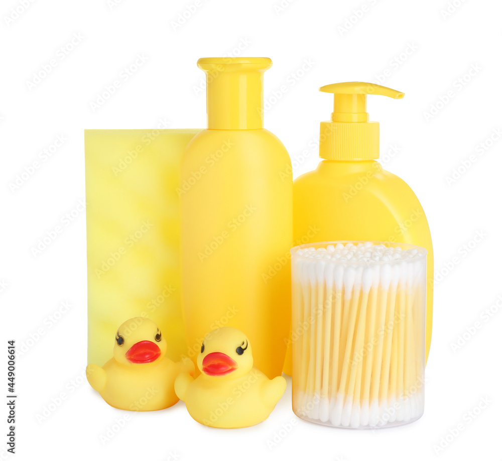Bottles of baby cosmetic products, toys and accessories on white background Bottles of baby cosmetic products, toys and accessories on white background