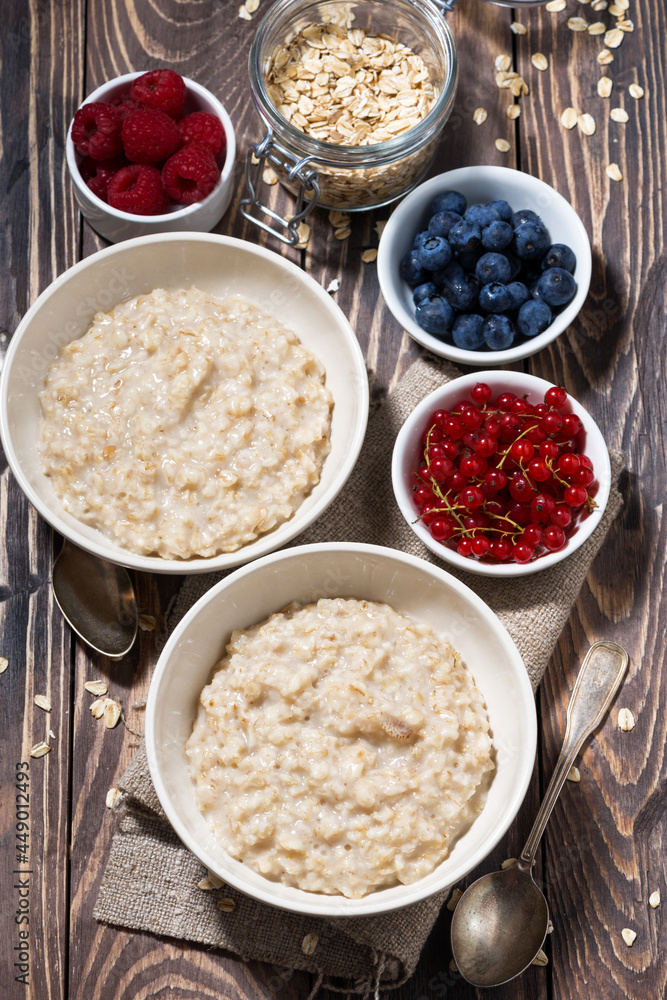 homemade oatmeal and berries, vertical top view homemade oatmeal and berries, vertical top view