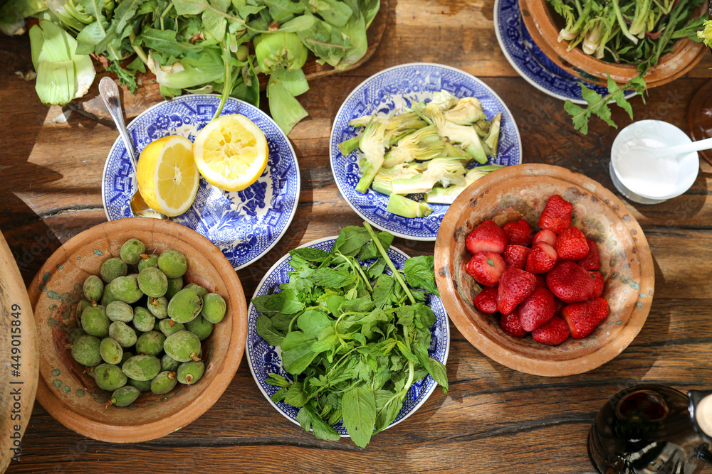 table prepared with healthy fruits and herbs