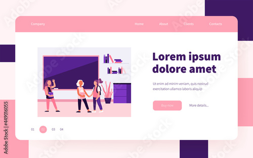 Schoolgirls meeting in classroom. Group of friends, classmates holding hands, waving hello flat vector illustration. Communication, friendship concept for banner, website design or landing web page