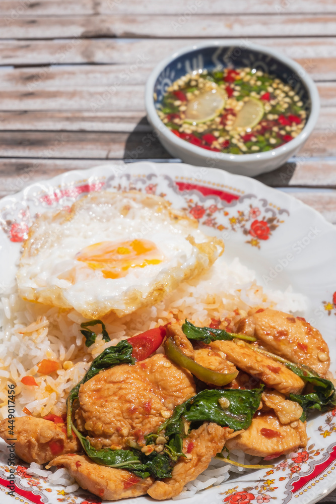 Stir Fried Chicken with Basil and Fried Egg on Rice Stir Fried Chicken with Basil and Fried Egg on Rice