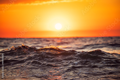 Fototapeta Naklejka Na Ścianę i Meble -  Sea wave close up, low angle view, sunrise shot