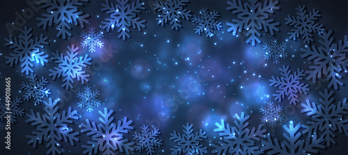 Magic light background with snowflakes. Abstract holiday backdrop.