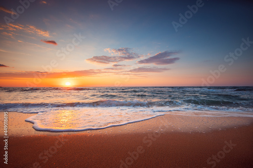 Fototapeta Naklejka Na Ścianę i Meble -  Beautiful sunset over the tropical sea and exotic beach