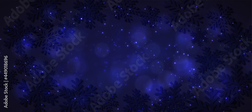 Magic light background with snowflakes. Abstract holiday backdrop.