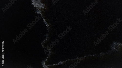 elegant dark black marble artificial stone background showing beautiful veins and grains texture. close up interior marble tile background. 