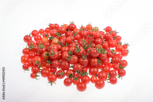Lot of cherry tomatoes on a white background