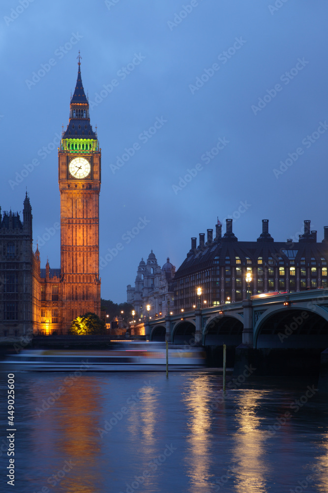 Palace of Westminster at dusk viewed from across the river Thames, London, UK