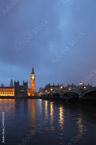 Palace of Westminster at dusk viewed from across the river Thames, London, UK