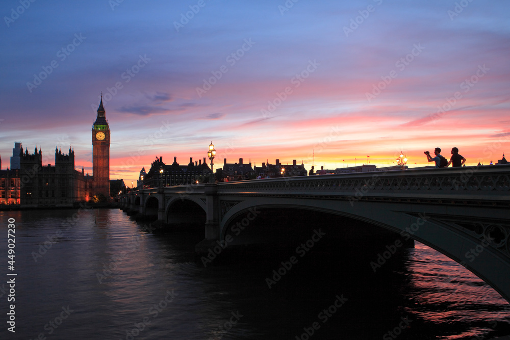 Palace of Westminster at dusk, viewed from across the river Thames, London, UK