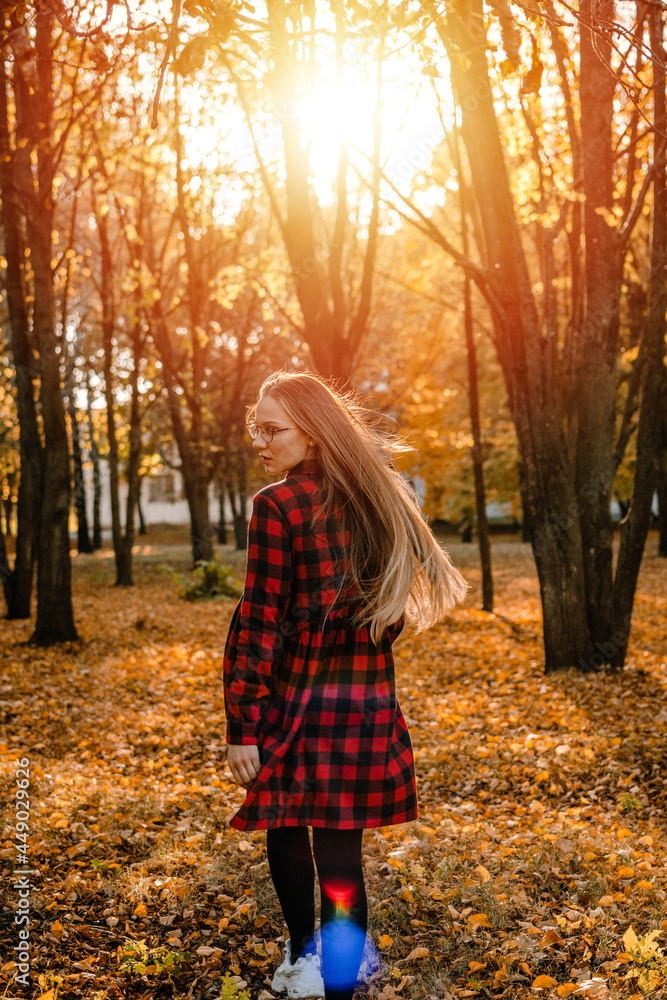 Vitamin D in autumn and winter season. Vitamin D in Womens Health, Role of Vitamin D3 Supplements in female health. Young woman enjoying sun in fall nature background Vitamin D in autumn and winter season. Vitamin D in Womens Health, Role of Vitamin D3 Supplements in female health. Young woman enjoying sun in fall nature background