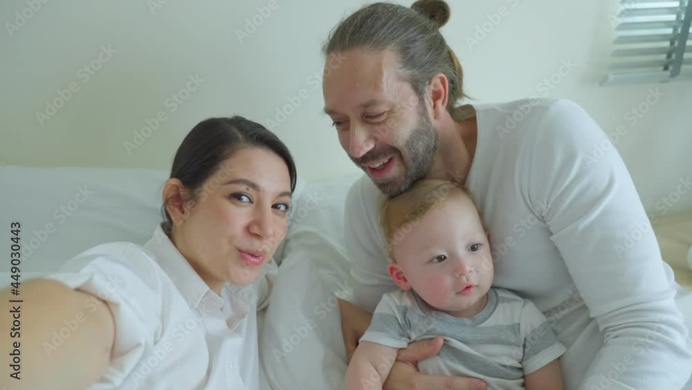 Caucasian Parents with little baby boy video call online with family. Caucasian Parents with little baby boy video call online with family.