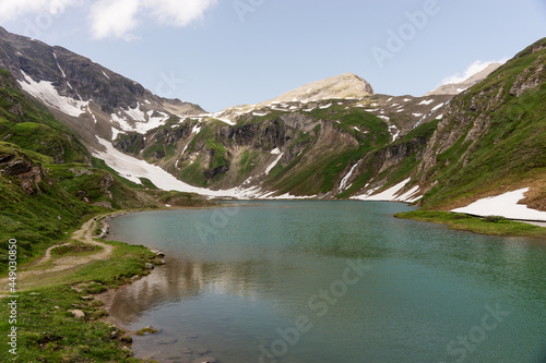 Alpine lake called Nassfeld Speicher in Hohe Tauern National Park. Austria