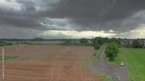 Drone video of Dornheim settlement in southern Hesse with passing high-speed train during approaching thunderstorm photo