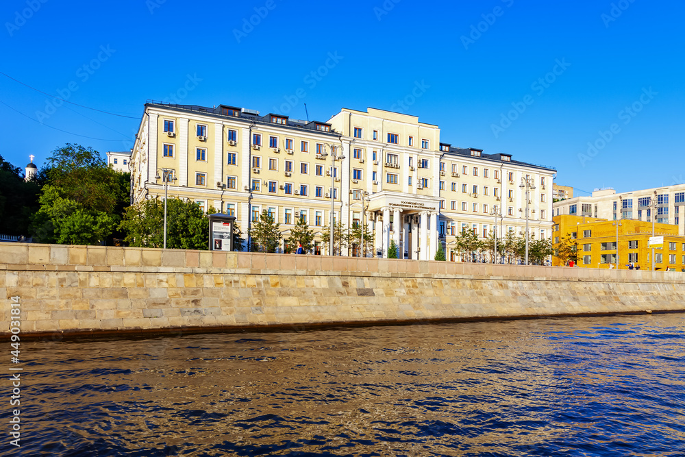 The building of the Russian Union of Industrialists and Entrepreneurs from the water of the Moscow River on a sunny summer day - Moscow, Russia, July 2021
