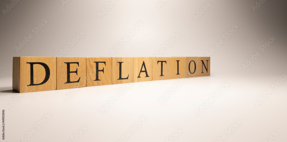 The name Deflation was created from wooden letter cubes. Economics and finance. The name Deflation was created from wooden letter cubes. Economics and finance.