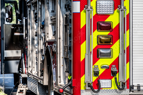 Back and side of firetuck showing open doors and eqipment photo