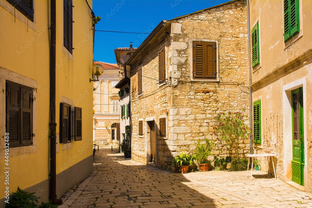 A quiet back street in the historic medieval coastal town of Porec in Istria, Croatia
