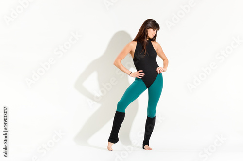 Shapely young woman wearing an 80s dance outfit