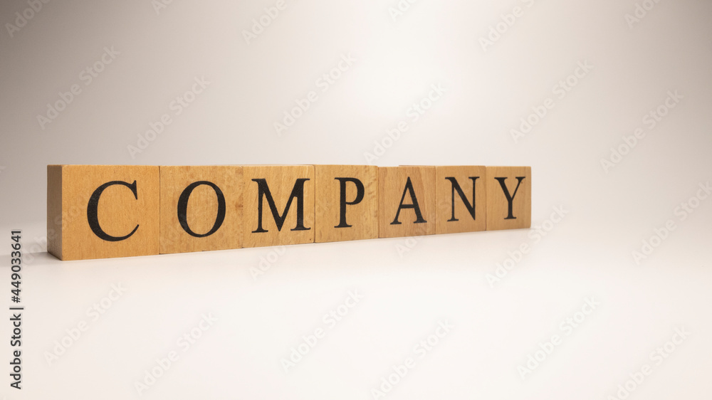 Company name was created from wooden letter cubes. Economics and Finance. Company name was created from wooden letter cubes. Economics and Finance.